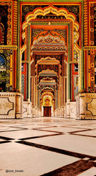 Ornate archways and corridors within a colorful Indian temple interior, Golden Triangle Tour.