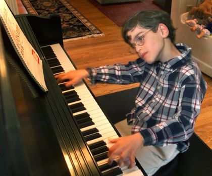 Savage at age 9, practicing at home.