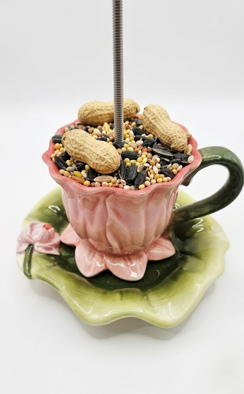 Thumbnail: closeup of detailed rose teacup and green saucer