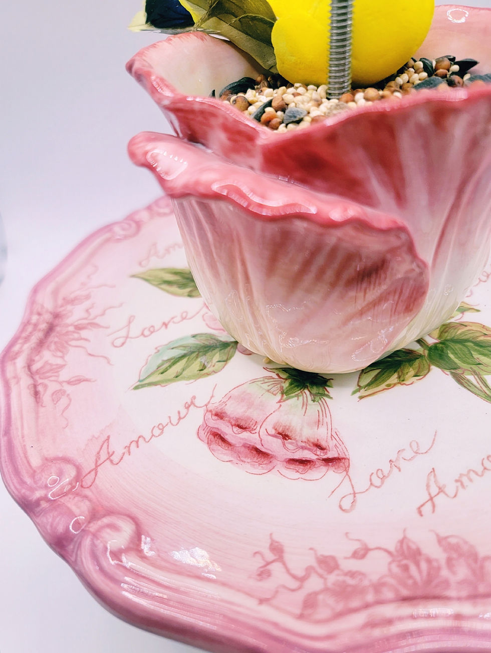 close-up of detailed flower-shaped teasett wild bird feeder with crystal glass cover and stainless steel hardware