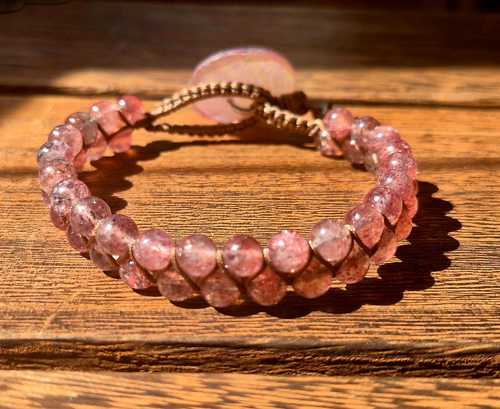 A side-angle perspective of the double-strand, strawberry quartz beaded bracelet featuring the unique, botanical button clasp