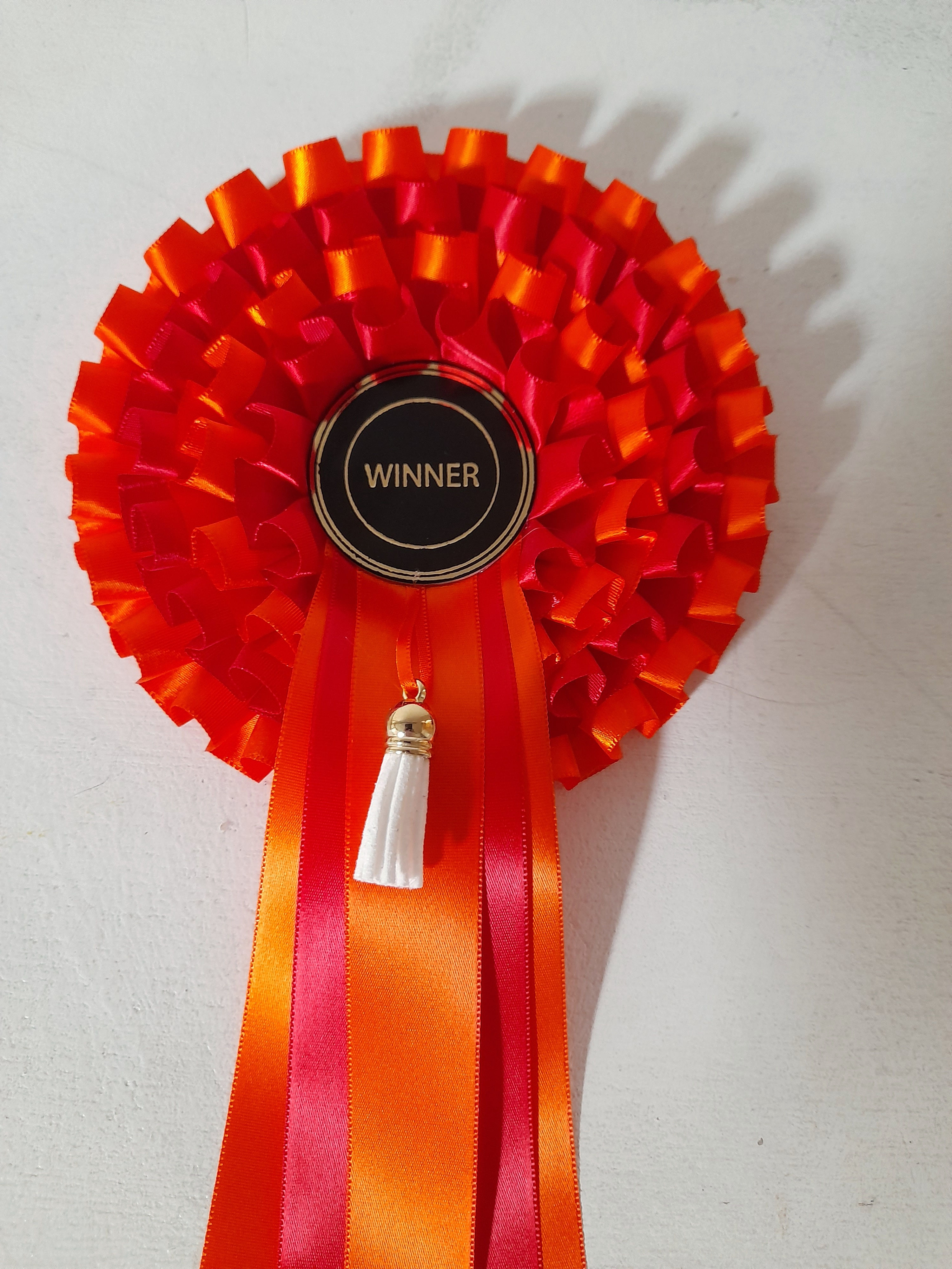 4 tier winner rosette with a tassel.