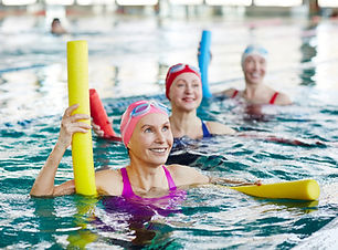 Smiling mature female in swimwear and tw