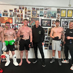 four men training with mens class SS8 Fight School