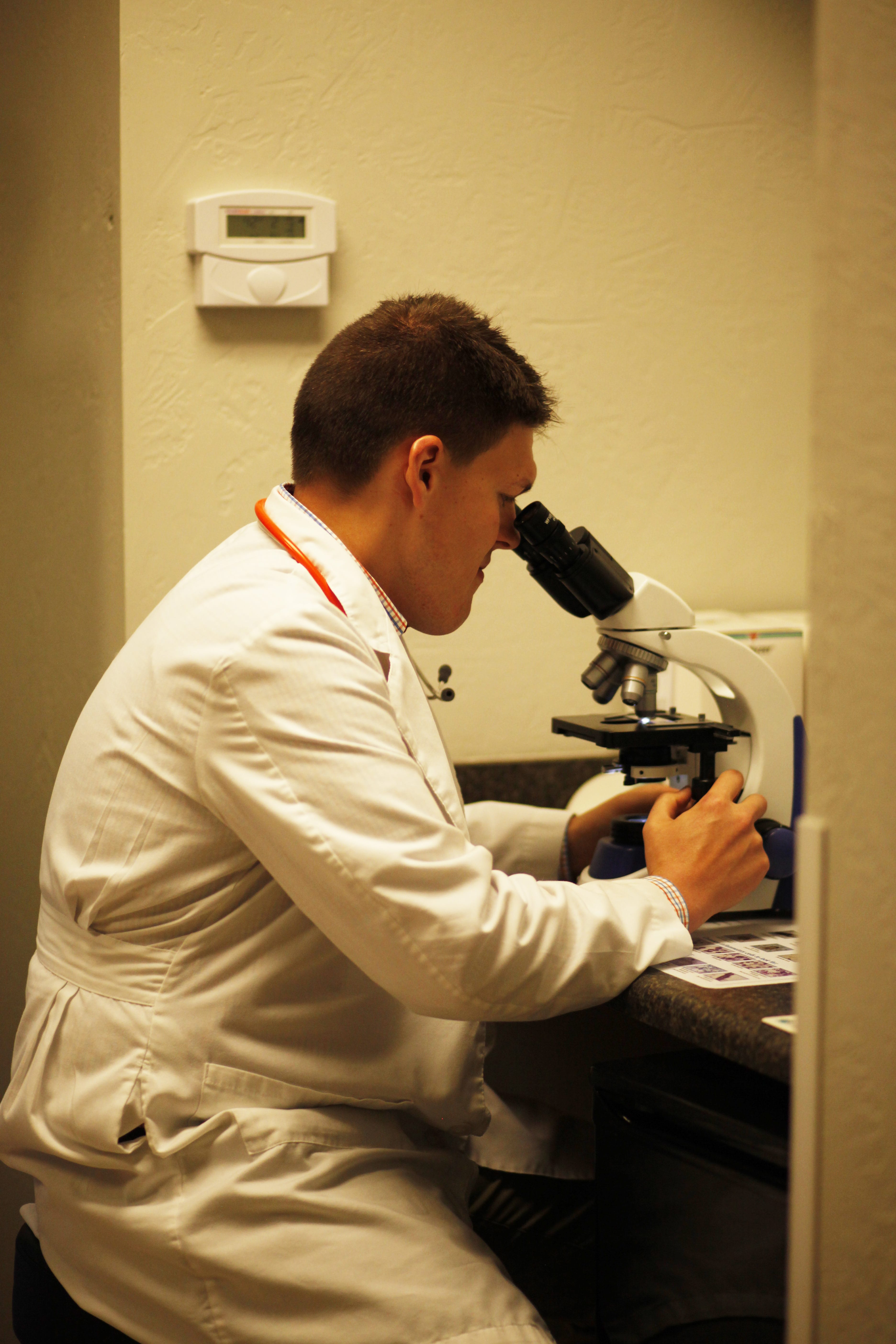 Dr. Kinser at the microscope
