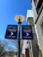 Two 'Agentless Touring' banners on a pole