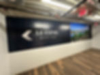 Leasing Office wall graphic with arrow