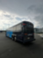 Bus advertising on a black and blue coach bus