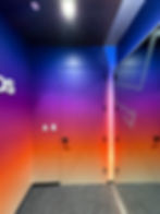 Gradient wall graphics with 'Ds' text and two doors