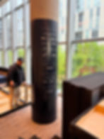 Pillar with sponsor logo wall graphics and man