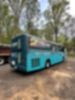 Teal bus with Ride Smart bus advertising