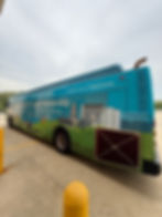 Bus advertising with 'Strength Through Partnership' ad