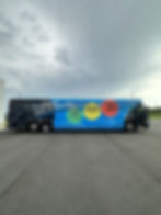 Bus advertising displaying transit investment metrics.