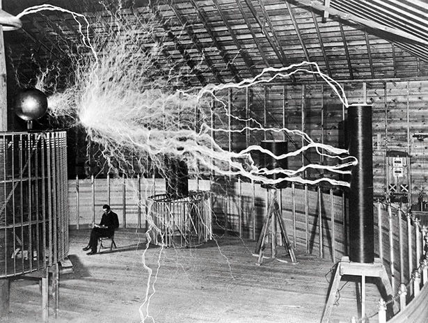 Tesla in h9s laboratory surrounded by electricity