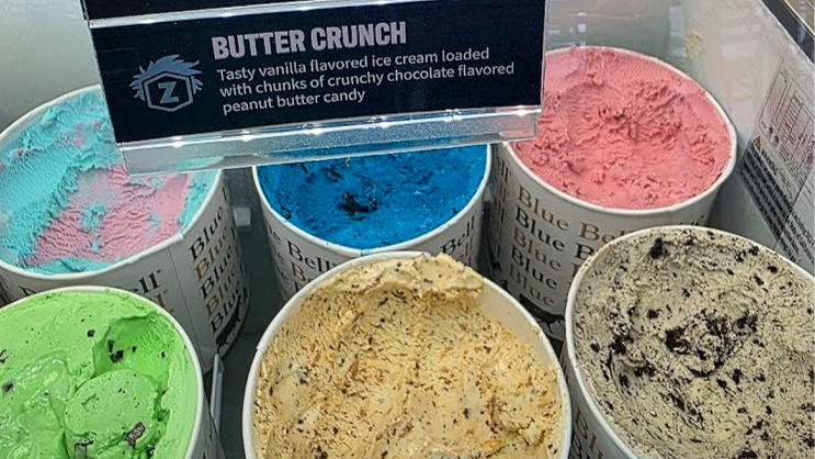 Photo of Zarley's ice cream flavors with a sign reading "Butter Crunch" Tasty vanilla flavored ice cream loaded with chunks of crunchy chocolate flavored peanut butter candy.