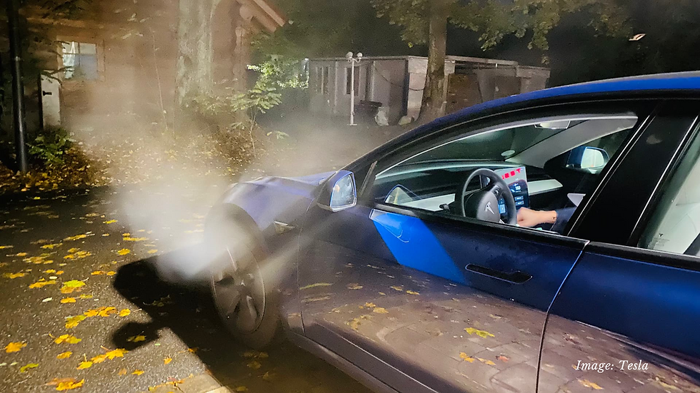 Tesla electric vehicle with fog cloud