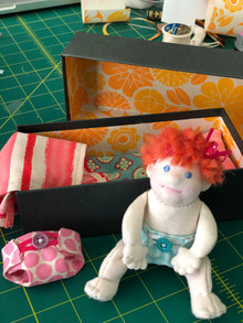 Baby doll in box bed