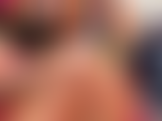 A close-up of an intricate, gold-embroidered Banarasi silk saree being examined in a busy market.