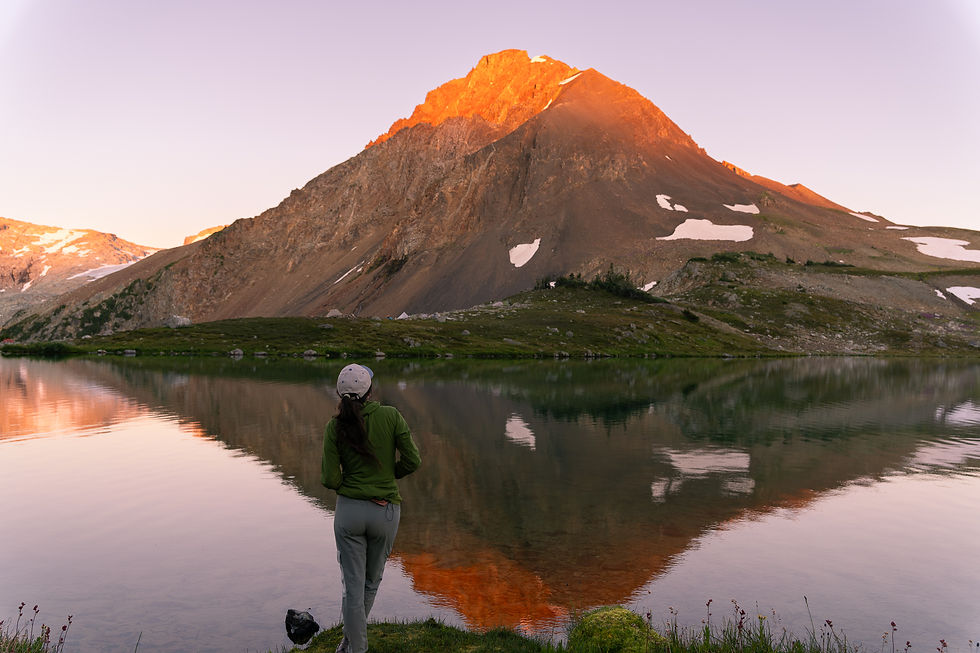 woman enjoying an alpine sunset at Russet Lake