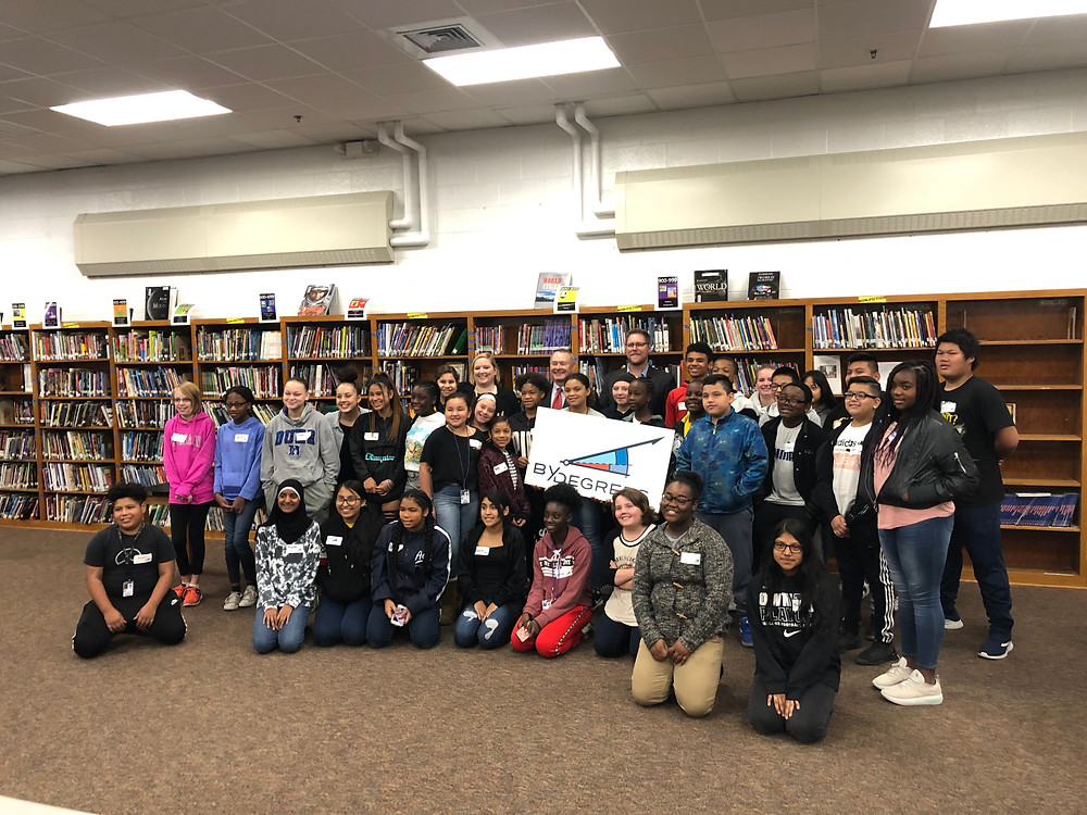 Group of Harding students pose for a photo with By Degrees CEO Emily Westergaard, State Treasurer Michael Fitzgerald, and Des Moines Public Schools Superintendent Dr. Tom Ahart.