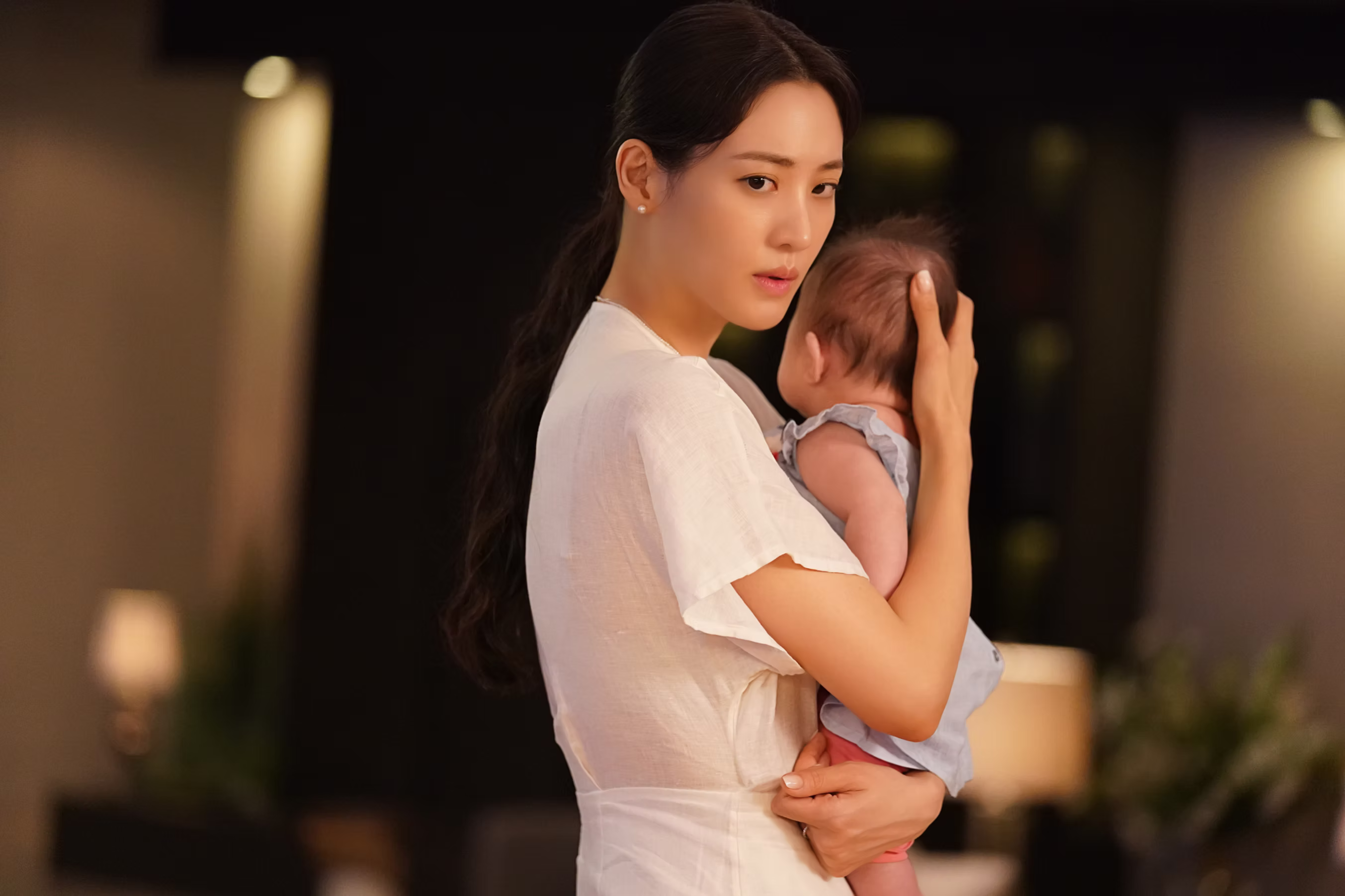 A woman holding a baby