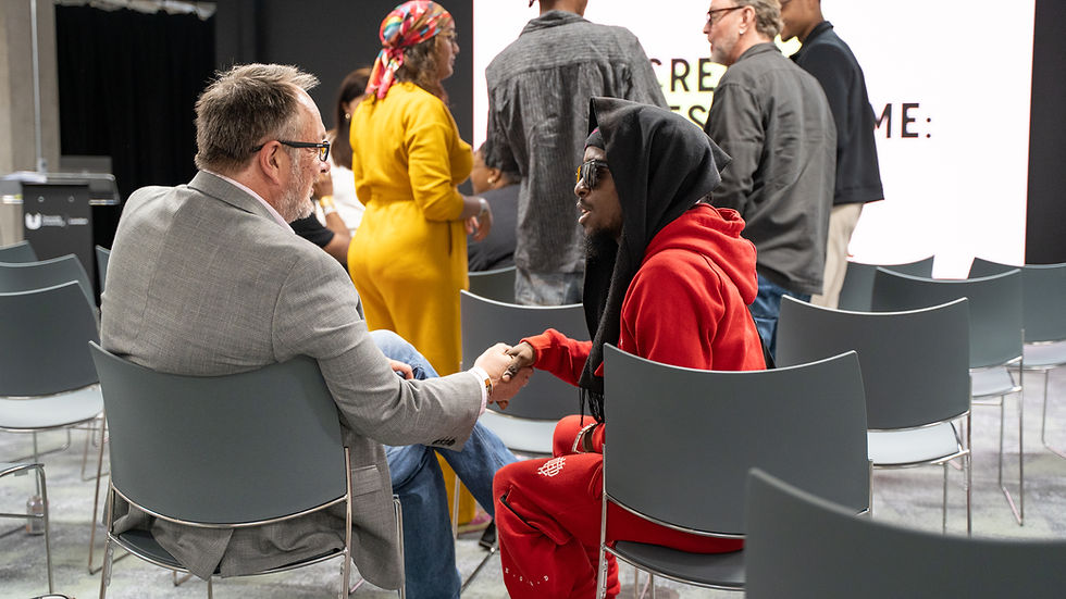 Board member and young person connecting at the DICE CIC rebrand event in July 2025.