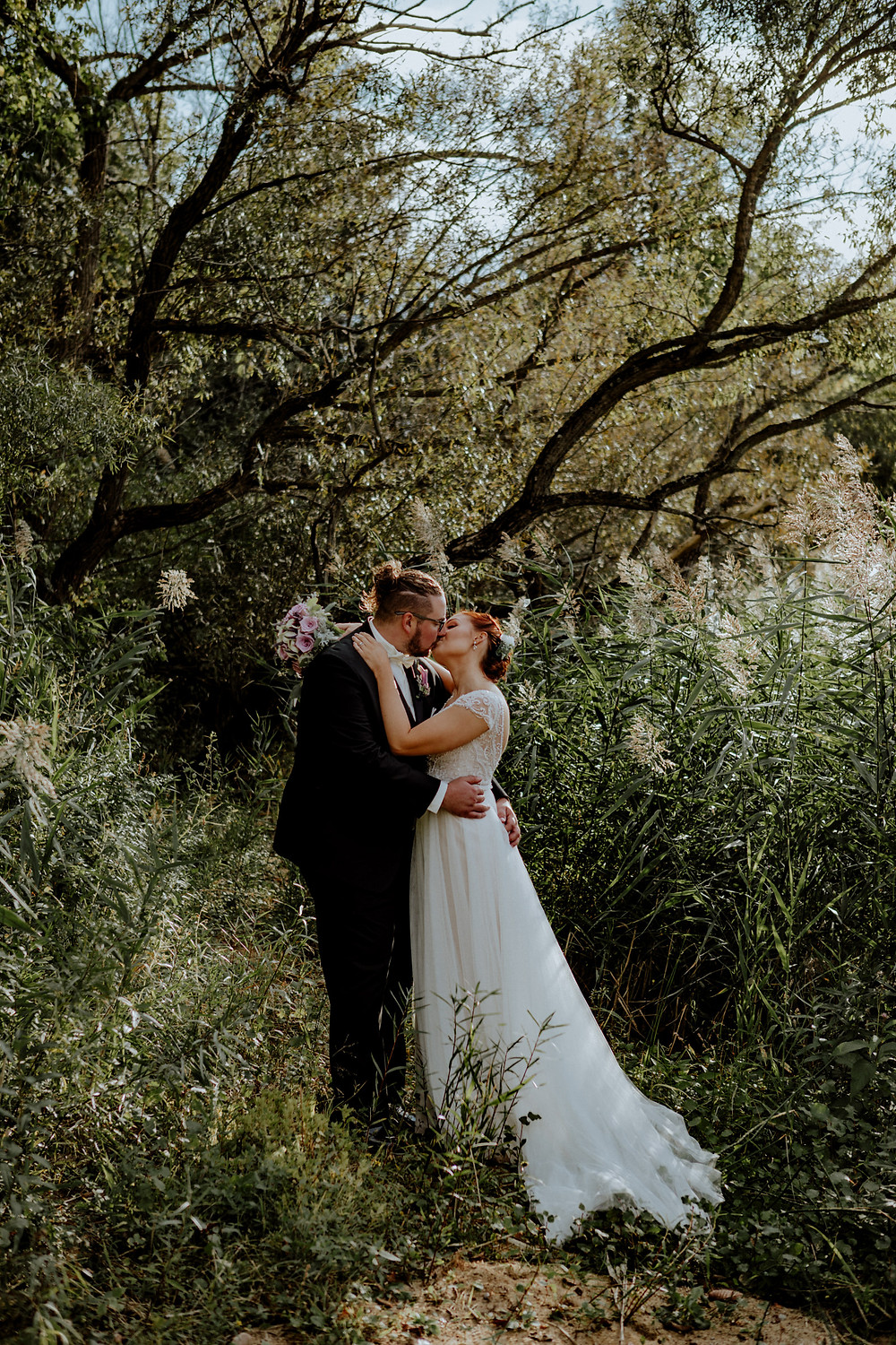 wedding photo by Little Blue Bird Photography in Hartland, Michigan, at Waldenwoods