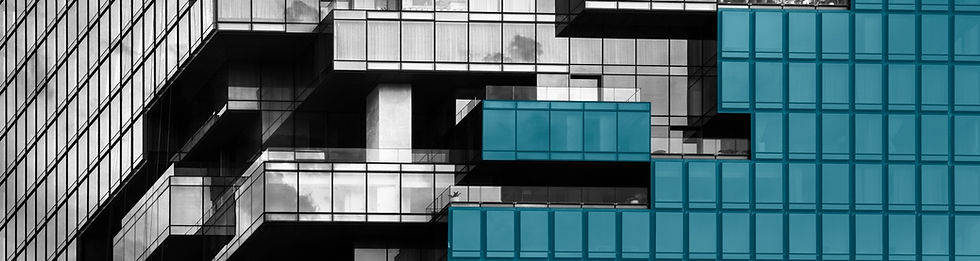 Modern glass building with blue and white geometric panels