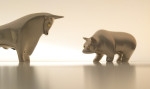 Bull and bear metal figurines facing each other