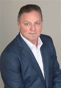 Professional headshot of a team member at Our Firm.