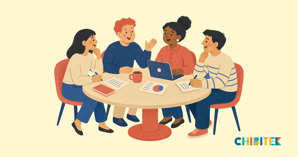 Small business team reviewing the year’s goals together around a table