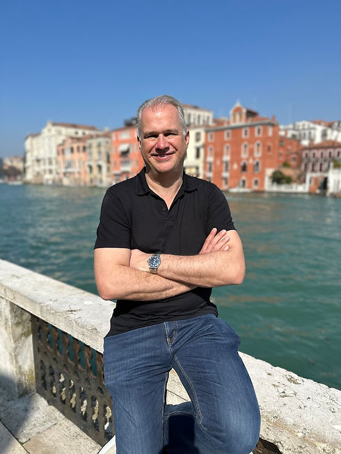 Nick on holiday in Venice with The Grand Canal behind him