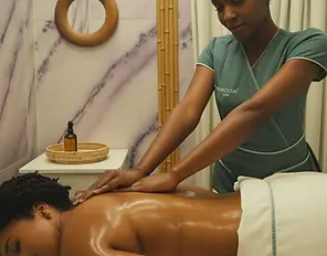 Woman receiving relaxing back massage at Tranquilitas Day Spa
