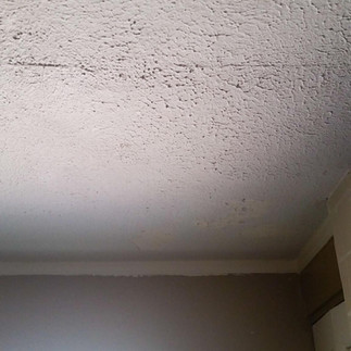 Large ceiling crack with separation indicating possible structural movement