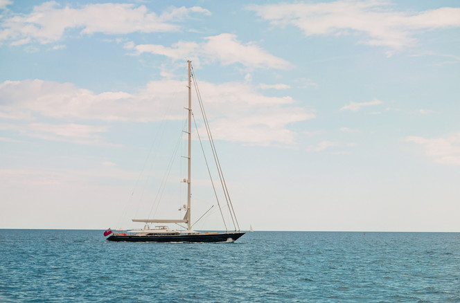 A yacht on the turquoise sea | Amalfi Coast travel photography by RollingBear Travels.