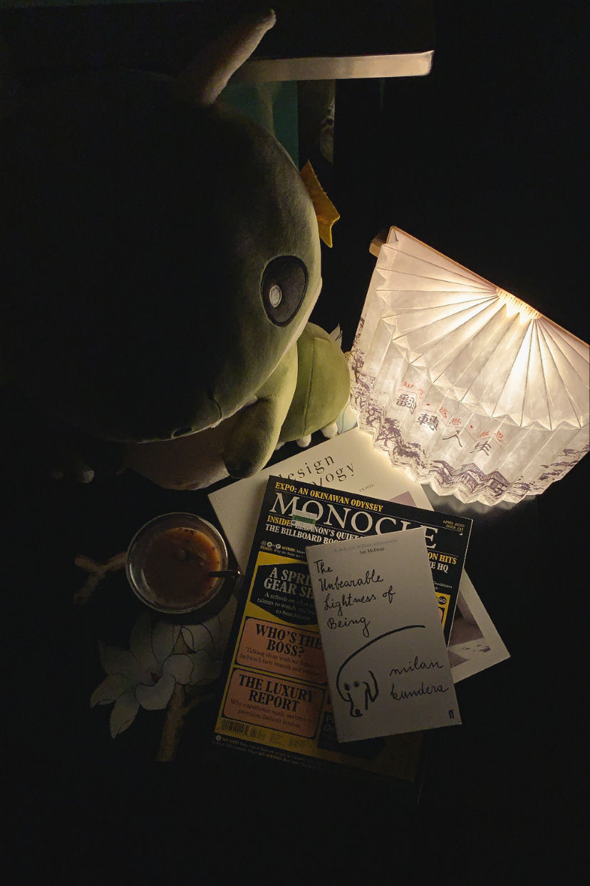 Lifestyle Photography of books and lamp in a dark room | RollingBear Travels