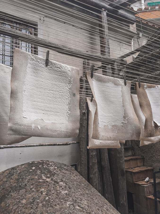 Paper hung to dry at the Amalfi Paper Museum | RollingBear Travels.