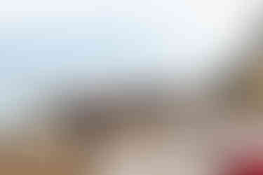 A girl walking down the beach of Positano towards the pier | RollingBear Travels.