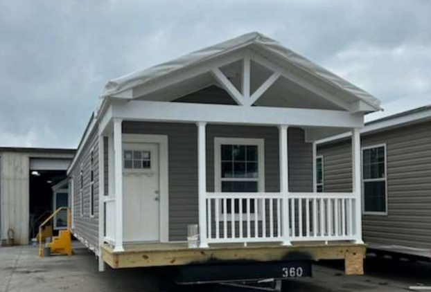 Gray modular ADU with white porch