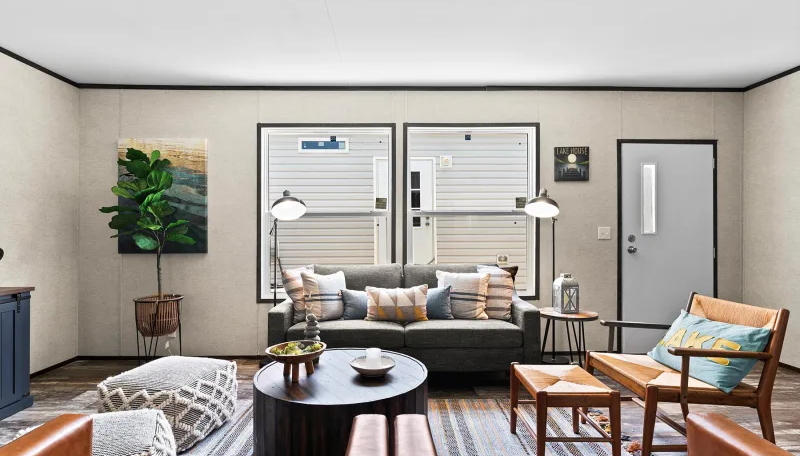 Modern living room with sofa, coffee table, and armchair