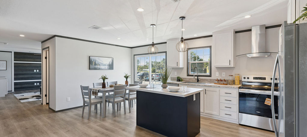 Open kitchen and dining room with blue island