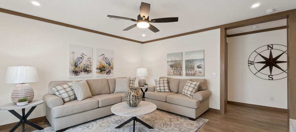 Living room at The Wellington with neutral sofas and decor