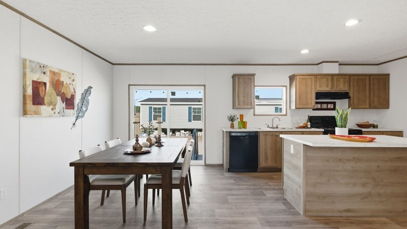 Modern open-plan kitchen with island and dining table