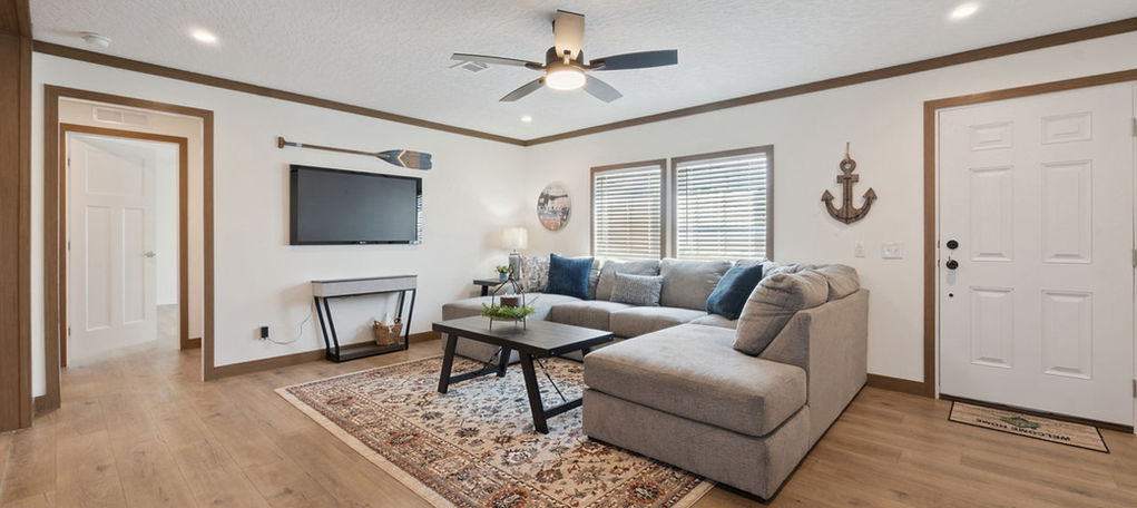 Living room with sectional sofa and nautical decor