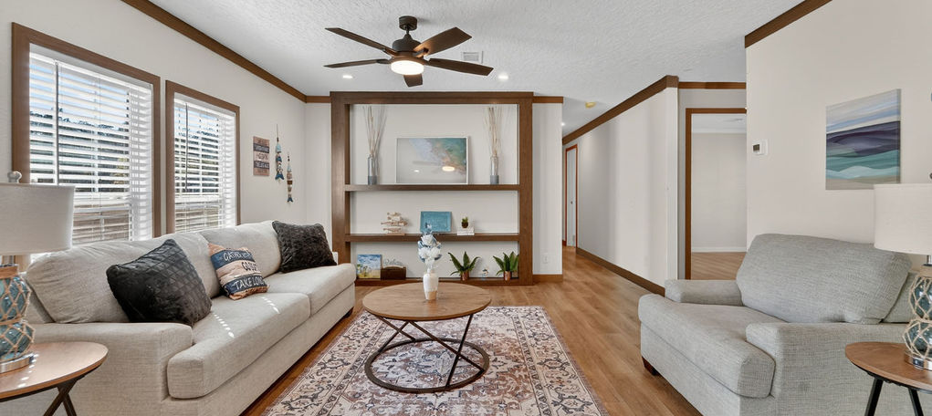 Modern living room with a white sofa and wood accents