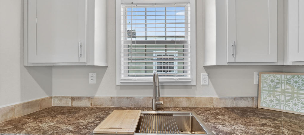 Modern kitchen with stainless steel farmhouse sink