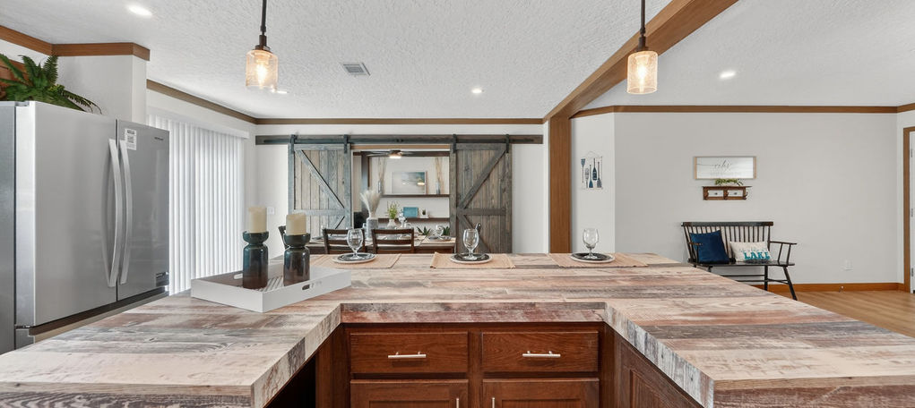 Modern kitchen island with textured countertops.