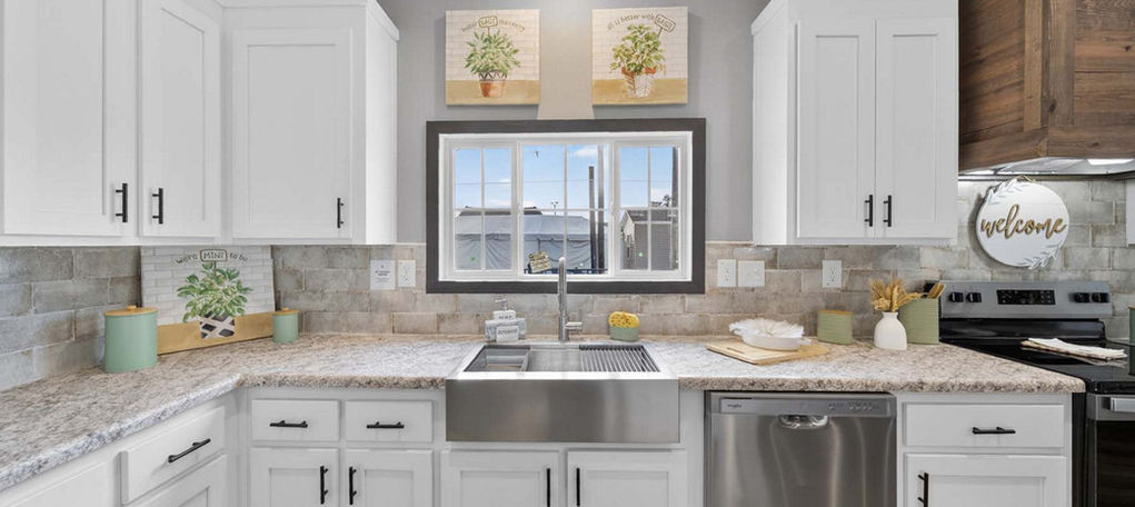 Modern kitchen with white cabinets and farmhouse sink