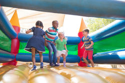 Children Playing on Bouncy Castle