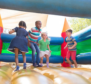 Children Playing on Bouncy castle in sports